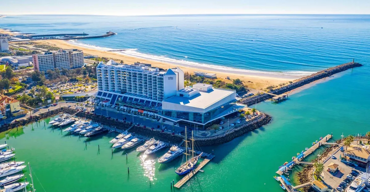 Aerial view of Tivoli Marina Vilamoura between the marina and the Atlantic beach.