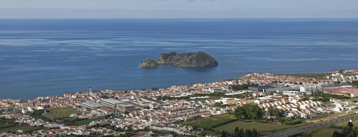 Vila Franca do Campo and its harbour below the chapel, with the Atlantic islet offshore.