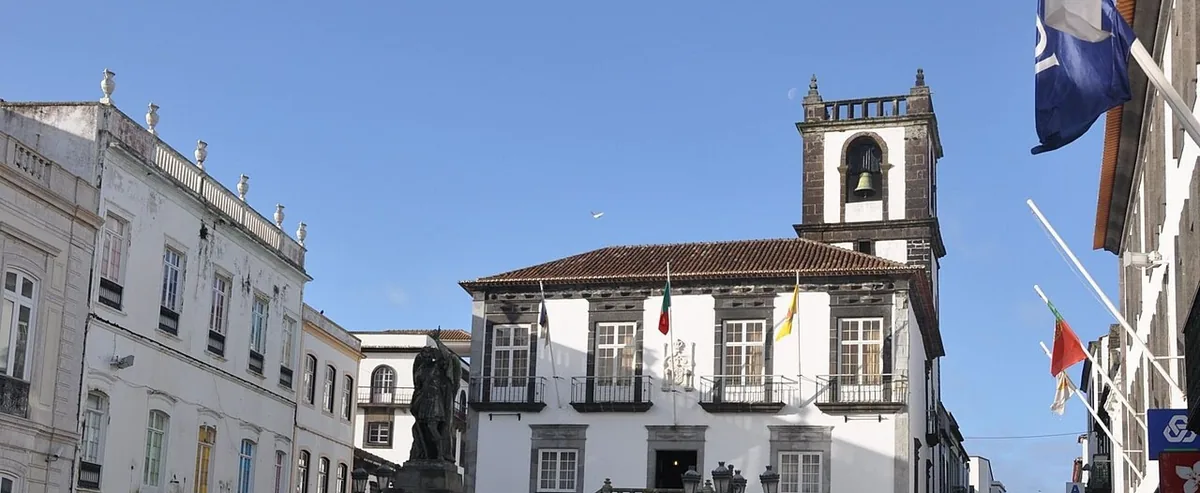 Ponta Delgada’s town hall and historic buildings around a paved square.